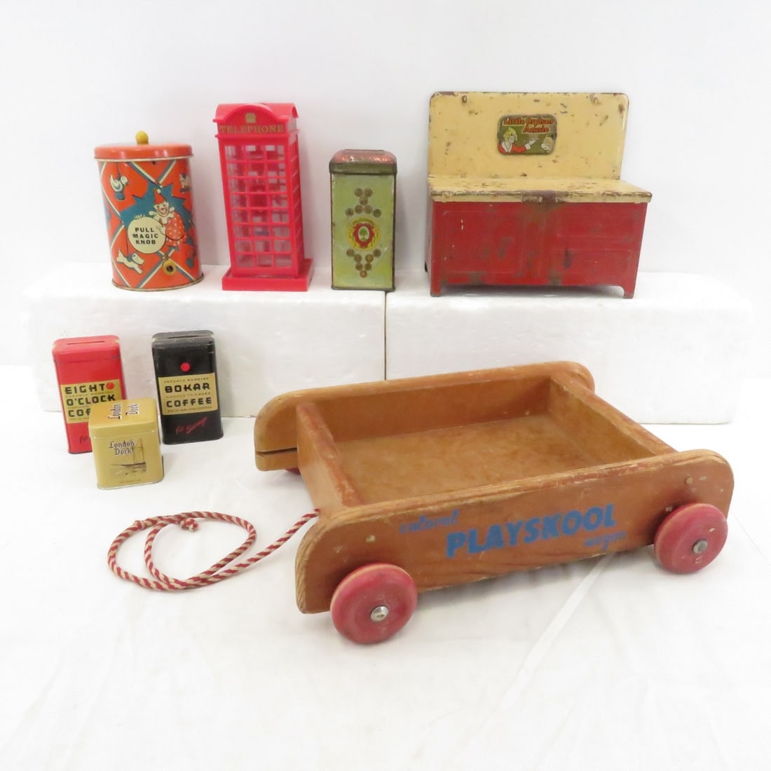 Vintage Toys, Tins & Coin Banks: Vintage Toys, Tins & Coin Banks - Little Orphan Annie metal stove, clown pop up toy, Droste's Cocoa Tin & More Please read terms & conditions and ask questions before bidding.