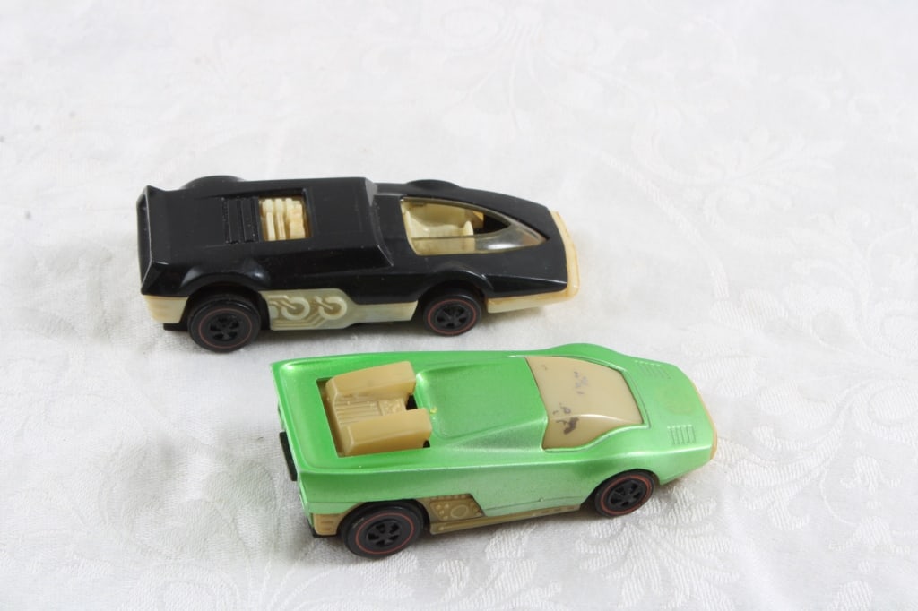 2 Hot Wheels 1969 SIzzlers Cars: 2 Hot Wheels 1969 Redline Cars - Straight Scoop & Sideburn Both as pictured. Please ask questions and read terms & conditions before bidding.