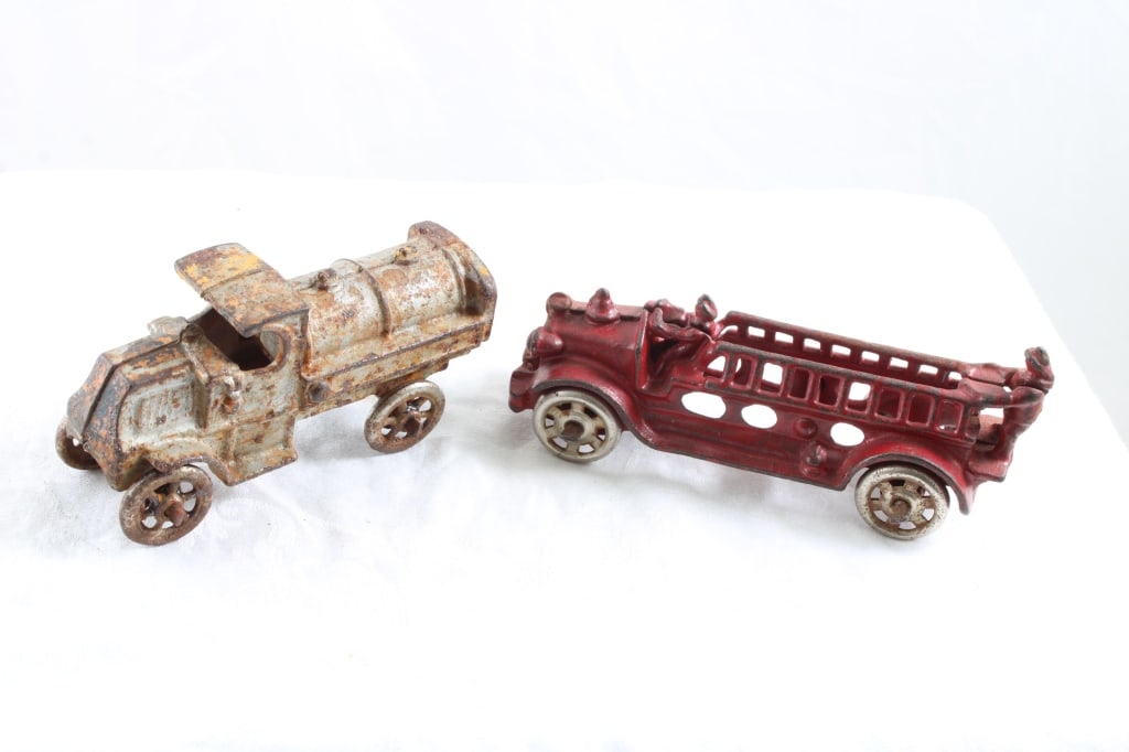 Cast Iron Fire Ladder Truck & Oil Tanker Truck: Cast Iron Fire Ladder Truck & Oil Tanker Truck - Fire Truck measures 5 1/4" long and Tanker Truck measures 4 1/4" Long. Both as pictured. Please ask questions and read terms & conditions before biddin