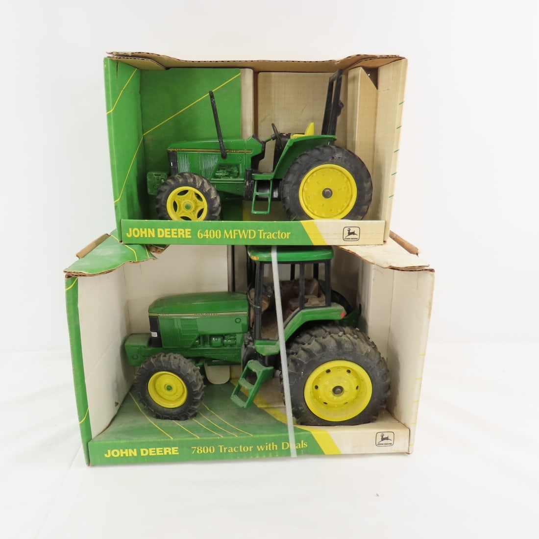 ERTL John Deere 7800 & 6400 MFWD tractors in boxes: ERTL John Deere 7800 & 6400 MFWD tractors in boxes -7800 tractor with MFWD & duals, 6400 MFWD tractor 1:16 scale Please ask questions and read terms & conditions before bidding.