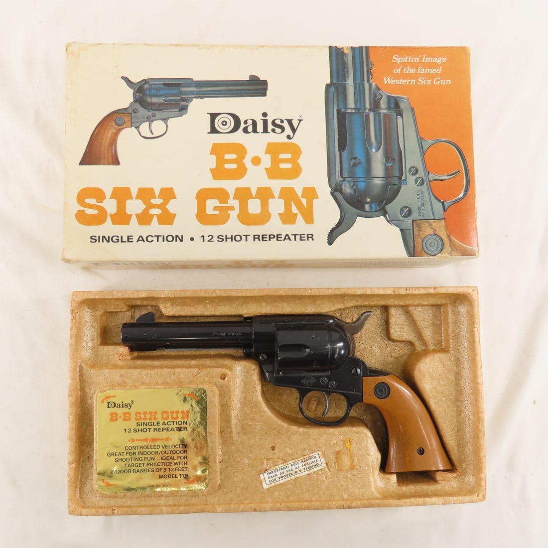 Daisy BB Six Gun in box .177cal single action: Daisy BB Six Gun in box .177cal single action - 12 shot repeater, functional Please ask questions and read terms & conditions before bidding.