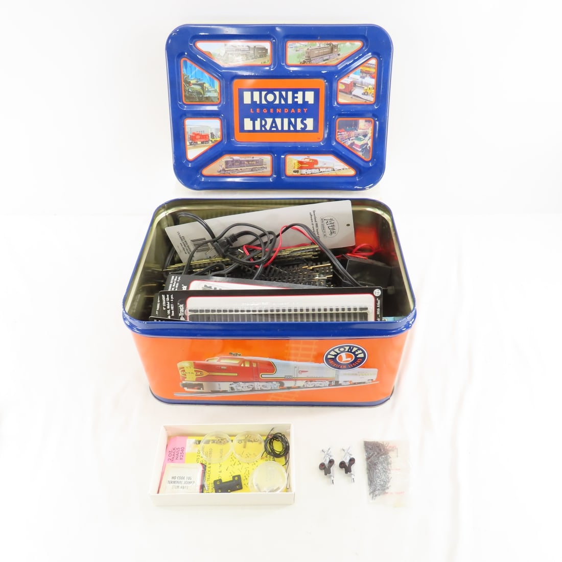 Atlas HO Scale Train Track in Lionel Tin: Atlas HO Scale Train Track in Lionel Tin - Some Track NIP, No 6607 Hobby Transformer, Lionel Legendary Collectors Tin Please ask questions and read terms & conditions before bidding.