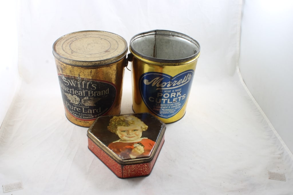 3 Advertising Buckets/Tins: 3 Advertising Buckets/Tins - Swifts Silverleaf Lard 8 lbs. missing handle, Morrell's Pork Cutlets 10 lbs. missing lid & Triangular Candy Tin all as pictured. Please ask questions and read terms & cond