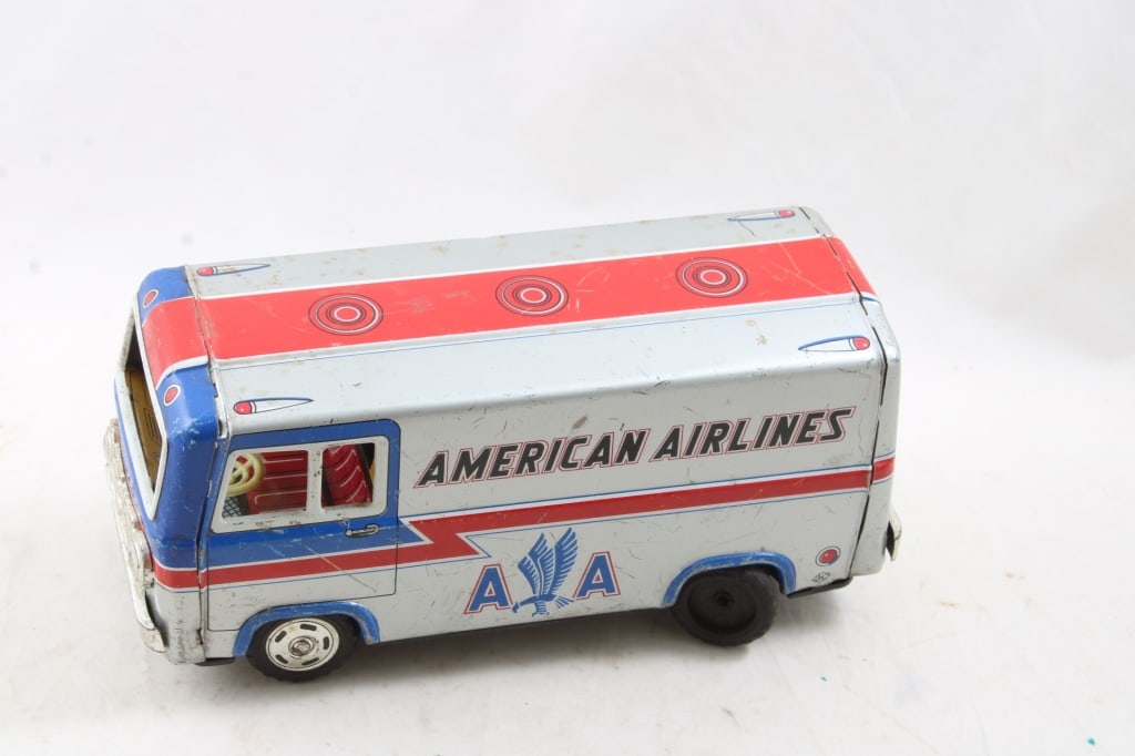 American Airlines Tin Friction Van Haji Japan 8": American Airlines Tin Friction Van Haji Japan 8" - Friction does not work and one wheel is loose & missing hubcap as pictured. Please ask questions and read terms & conditions before bidding.
