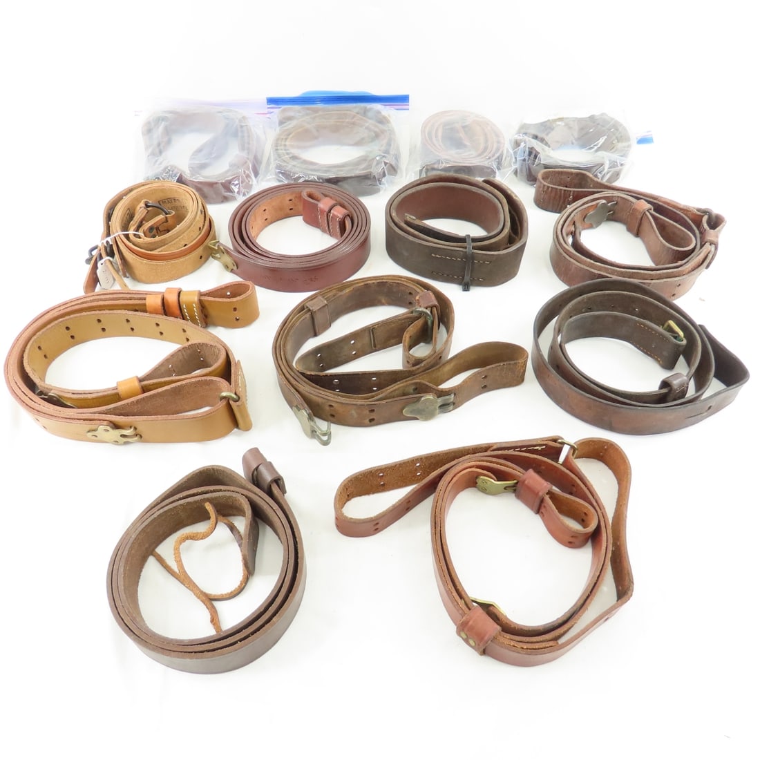 13 Military Leather Slings, Some WWII: 13 Military Leather Slings, Some WWII - Please read terms & conitions and ask questions before bidding.