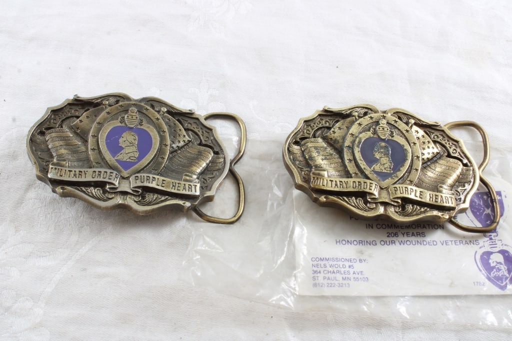 2 Purple Heart 3" Belt Buckles 1 is NIP: 2 Purple Heart 3" Belt Buckles 1 is NIP - As pictured. Please ask questions and read terms & conditions before bidding.