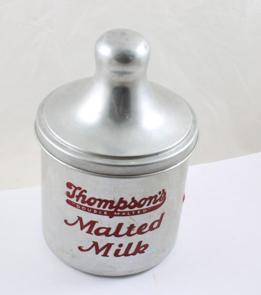 Thompson's Double Malted Milk Aluminum Canister: Thompson's Double Malted Milk Aluminum Canister - Measures 10" Tall with lid. As pictured. Please ask questions and read terms & conditions before bidding.