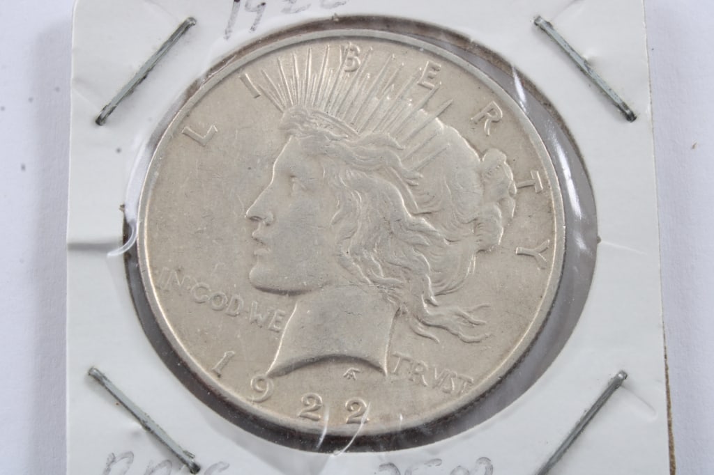 1922 Peace Silver Dollar: 1922 Peace Silver Dollar - As pictured. Please ask questions and read terms & conditions before bidding.