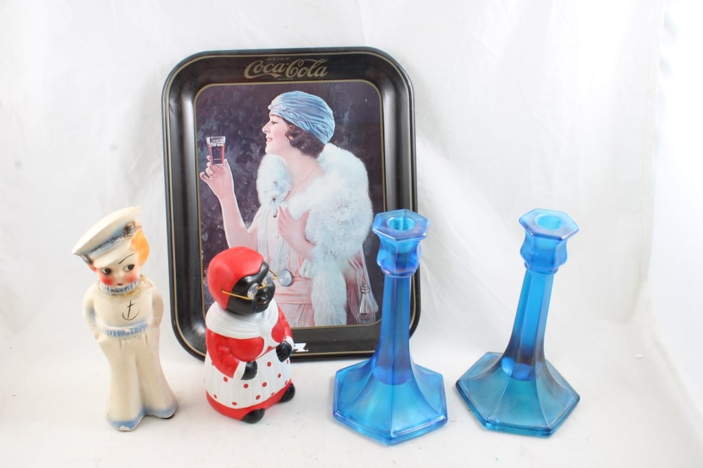 Coke Tray, Chalkware, Mammy Bank, Candleholders: Coke Tray, Chalkware, Mammy Bank, Candleholders - 13 1/2" x 10" Coca Cola Tray, Sailor Chalkware Figurine 9 1/2" Tall (has head repair), 7" Mammy Bobblehead Bank, Pair of Blue Glass Candleholders. All