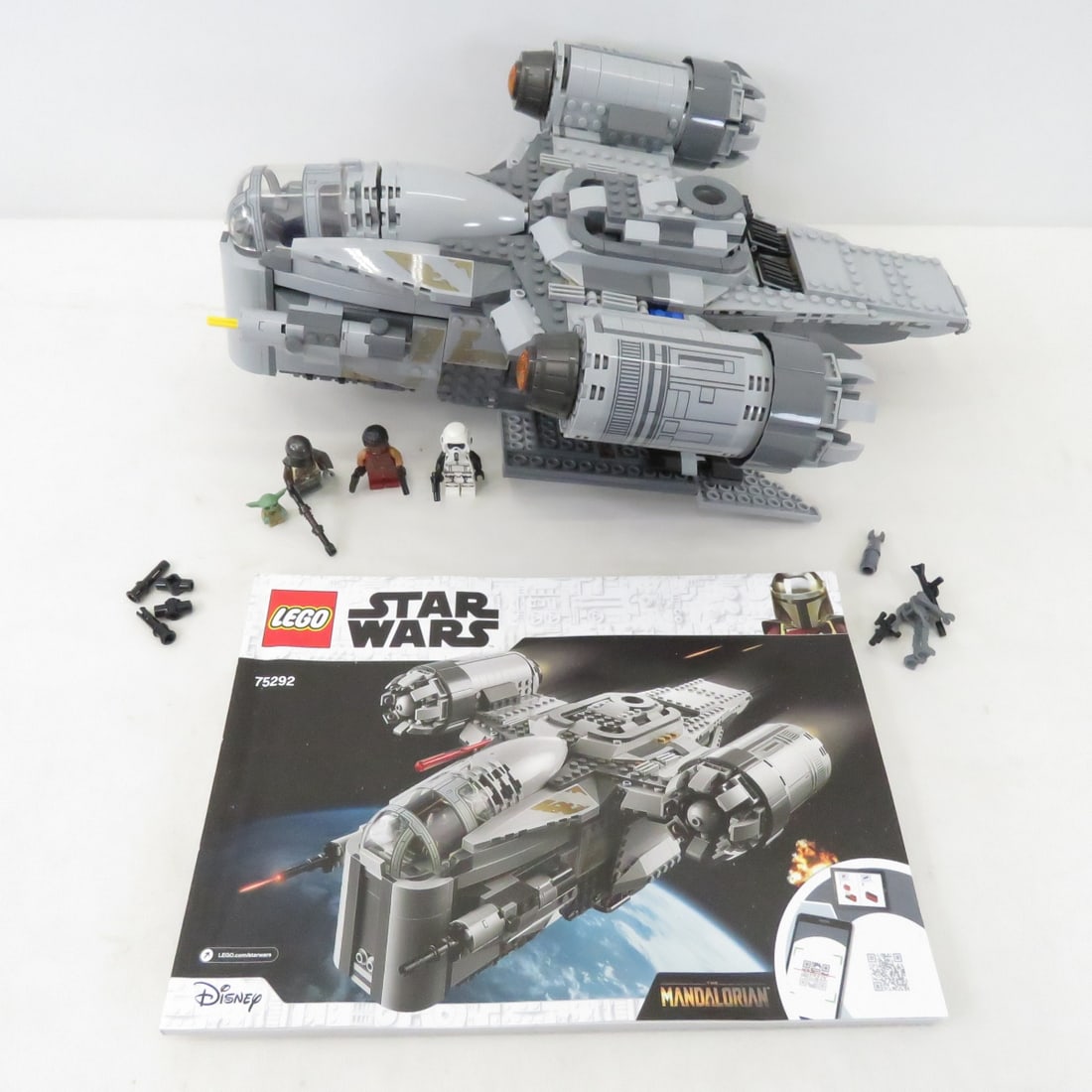 LEGO STAR WARS #75292 The Razor Crest: LEGO STAR WARS #75292 The Razor Crest - With Booklet. As shown Please read terms & conditions and ask questions before bidding.