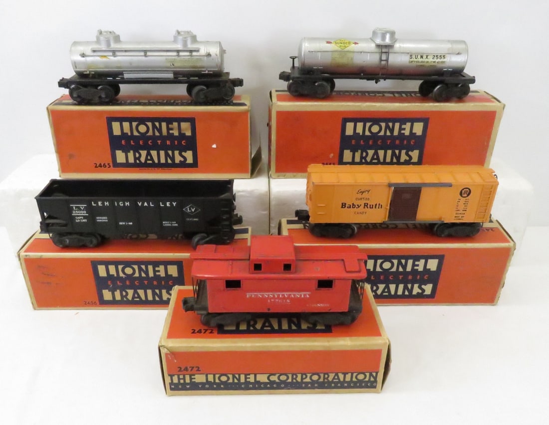 5 Coil Coupler Lionel O Gauge Cars w/Boxes: 5 Coil Coupler Lionel O Gauge Cars w/Boxes - 2472 caboose, 2454 Box Car, 2456 Hopper, 2555 O gauge tank car, 2465 tank car, in original boxes (damage) Please read terms & conditions and ask questions 