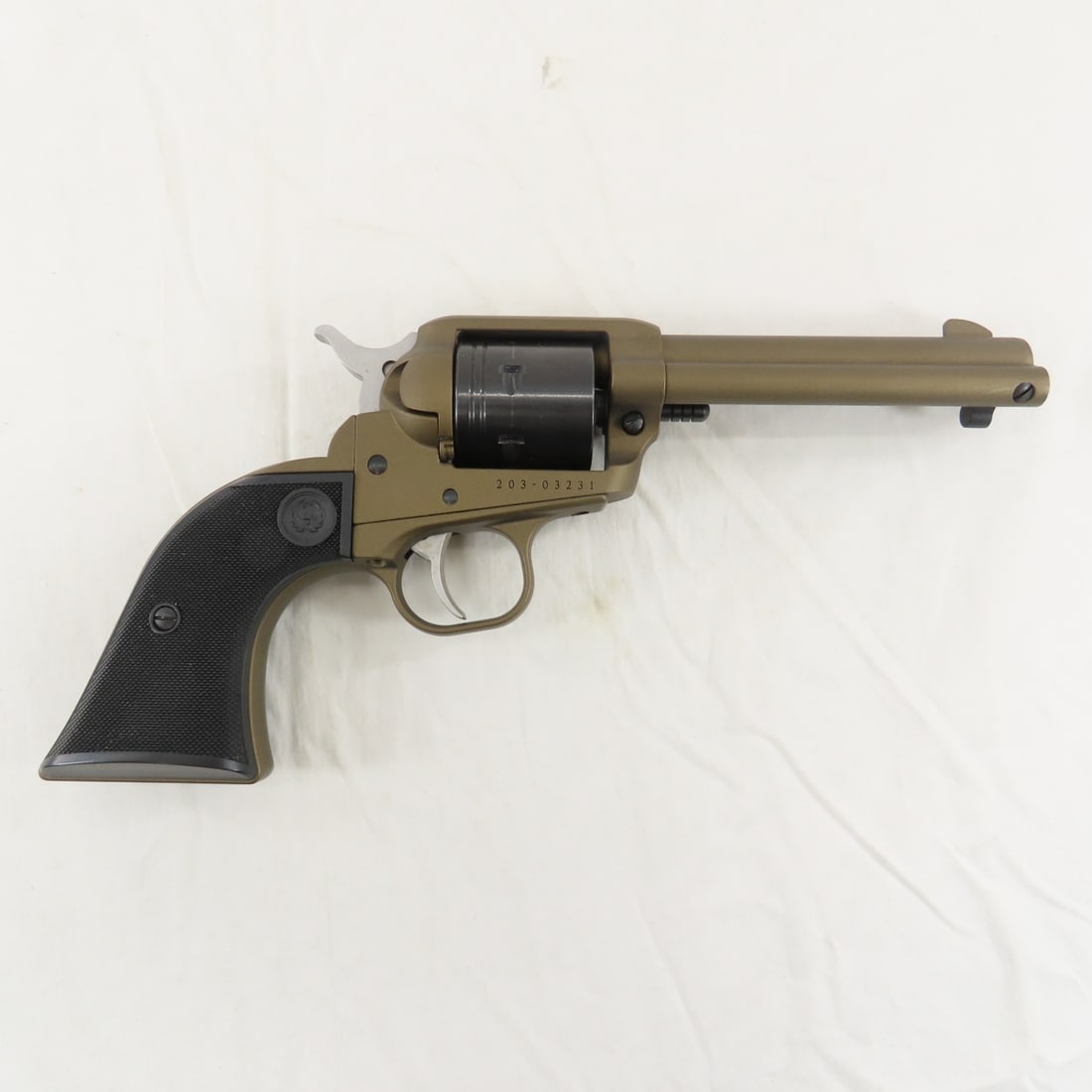 Ruger Wrangler .22LR SA Bronze Cerakote Revolver: Ruger Wrangler .22LR SA Bronze Cerakote Revolver-4.62" barrel with front blade sight, 6 shot, textured poly grips, SN# 203-0323. with hard case. FFL transfer required, please know local laws before bi