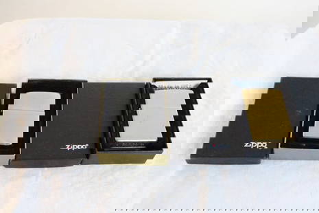 2 Zippo Lighters in Boxes Brass A 01 & Other: 2 Zippo Lighters in Boxes Brass A 01 & Other - Both as pictured. Please ask questions and rerad terms & conditions before bidding. 