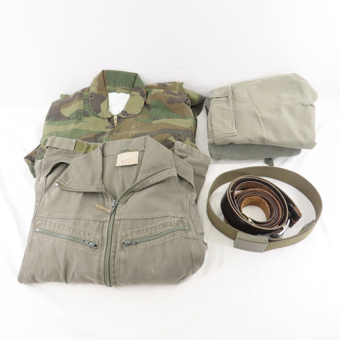 WWII German Army Pants, Coveralls, Belts & More: WWII German Army Pants, Coveralls, Belts & More - 2 pair Pants, 1 pair Tanker's Crew Coveralls, 1 Web Belt, 3 Leather Belts, 1 U.S. Woodland Camo Coveralls Please ask questions & read terms conditions