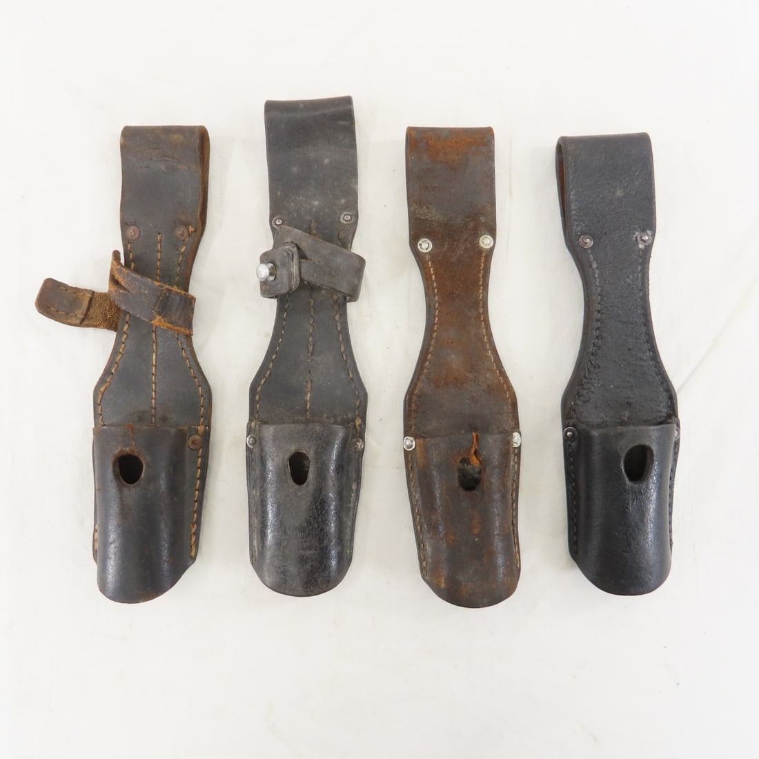 4 WWII Leather bayonet frogs: 4 WWII Leather bayonet frogs - Please ask questions & read terms conditions before bidding.