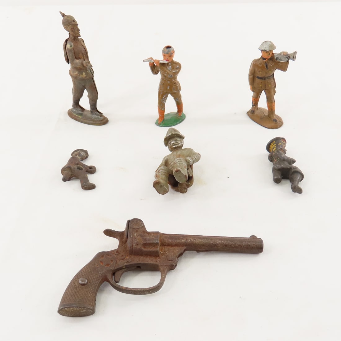Cast Iron Cap Gun, Misc Figures, Military & More: Cast Iron Cap Gun, Misc Figures, Military & More-3 Seated Cast Iron Figures, Tin Toy Soldier, Cast Iron & Plastic Military Figures, COP Cap GunPlease ask questions and read terms & conditions before b