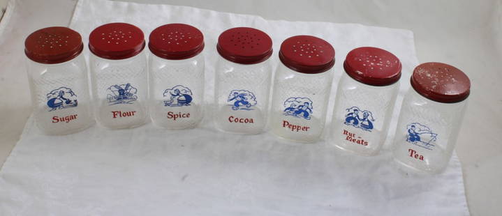 7 Hazel Atlas Dutch Glass Spice Shaker Jars: 7 Hazel Atlas Dutch Glass Spice Shaker Jars - with lids. Each measures 4 3/4" Tall. As pictured. Please ask questions and read terms & conditions before bidding.