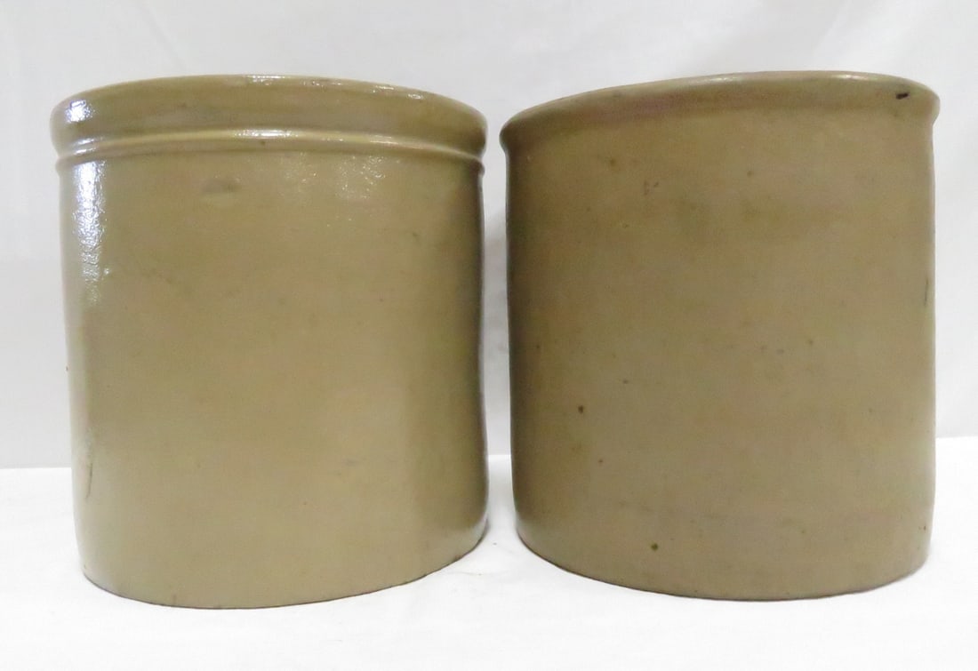 2 Salt Glaze 1 Gallon Stoneware Crocks: 2 Salt Glaze 1 Gallon Stoneware Crocks - both unmarked- 1 with tie ring, 8x8", very good condition Please ask questions and read terms & conditions before bidding.