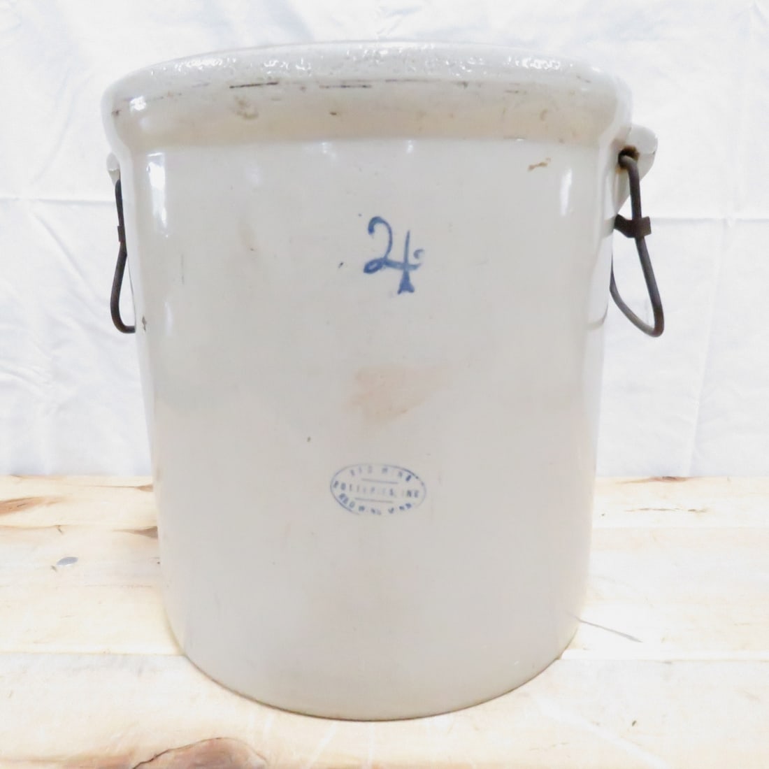 4 Gallon Red Wing Potteries Crock: 4 Gallon Red Wing Potteries Crock - with bale handles, faded wing, chip bottom back edge Please ask questions and read terms & conditions before bidding.