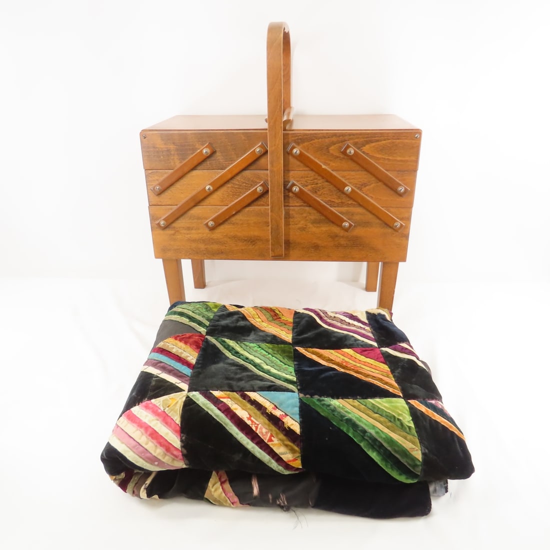 Norwegian Sewing Stand/Case & Quilt: Norwegian Sewing Stand/Case & Quilt - 10x19x23" fixed handle wood basket marked AS Strommen Bruk Hamar, hand sewn quilt 55x70"- velvet, silk and other fabric- some is shredding, has loops for hanging