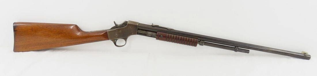J Stevens No 70 Visible Loading Repeater .22S,L,LR: J Stevens No 70 Visible Loading Repeater .22S,L,LR - patent date 07, slide action, 22" barrel (exterior pitting), front blade sight (replaced), rear leaf sight, tube feed- missing tube, ribbed