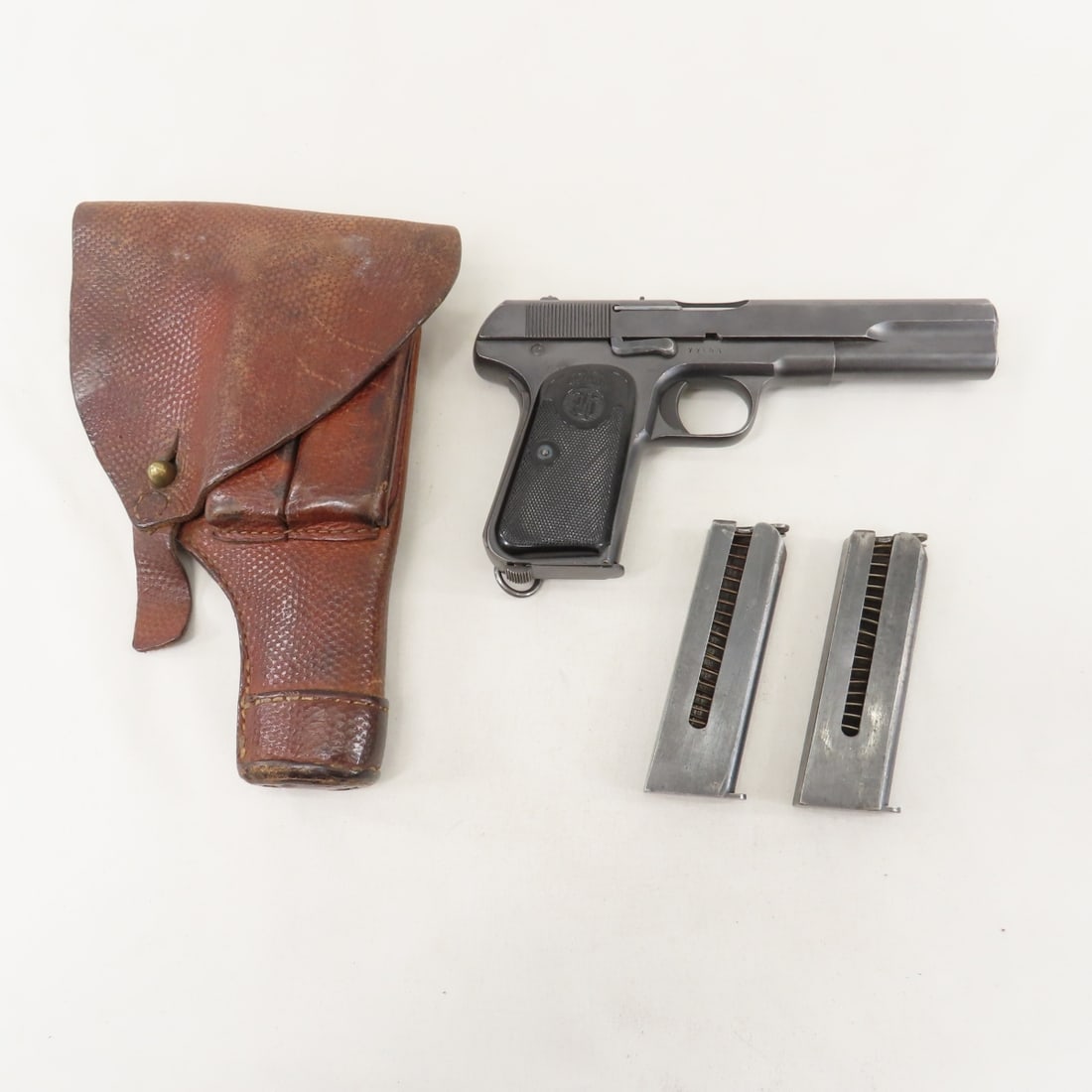 Swedish Husqvarna 1907 Pistol .380 ACP- Unit Mark: Swedish Husqvarna 1907 Pistol .380 ACP- Unit Mark - SN# 7748, I9 No.1863, no import marks, rechambered on import. 5" barrel, with front & rear sights, checkered plastic grips with crest, 3 magazines,