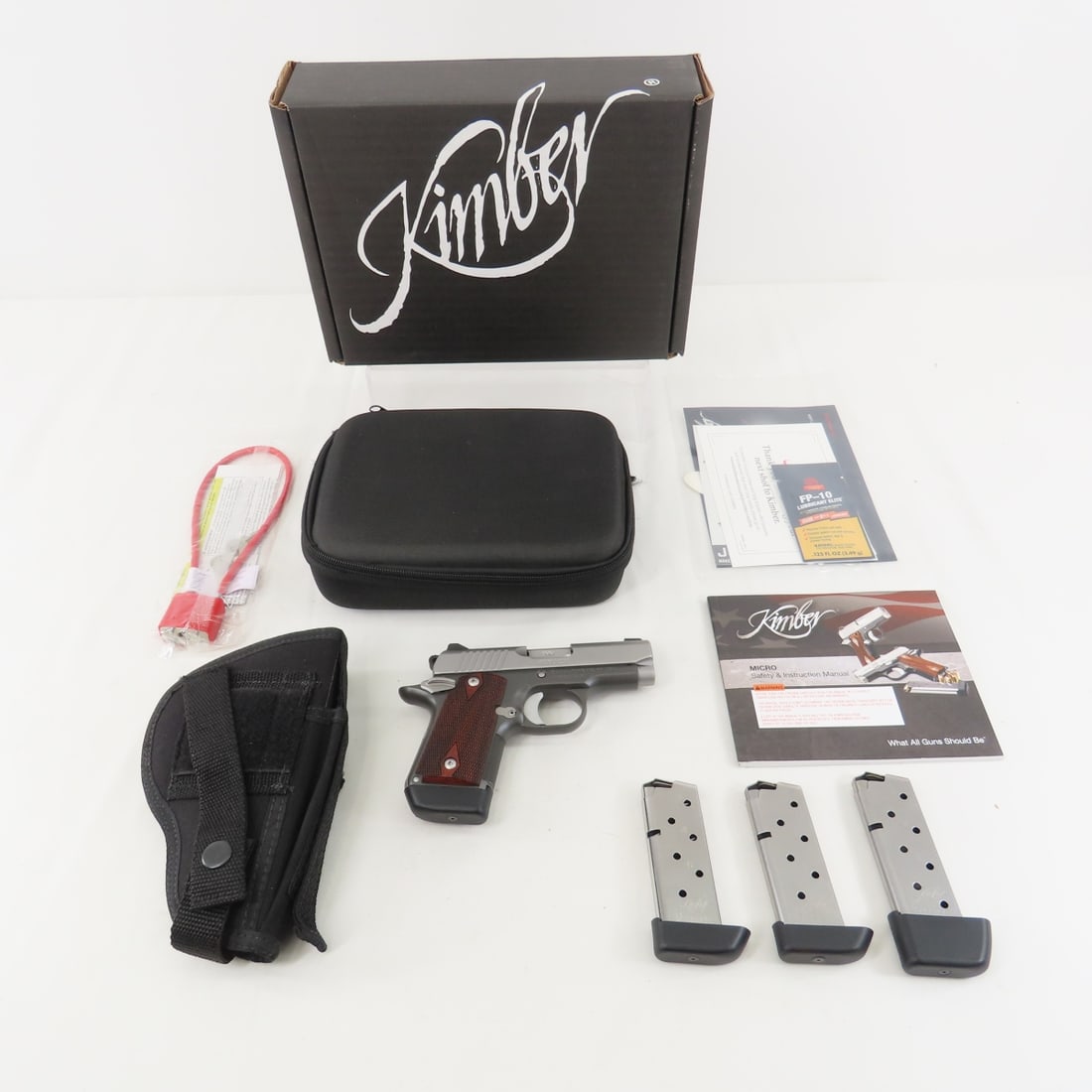 Kimber Micro 9 Two Tone CDP 9mm Pistol: Kimber Micro 9 Two Tone CDP 9mm Pistol - SN# PB0281513, 3 1/8" barrel, front & rear 3 dot sight system,checkered wood grips, 4 extended 7 round Kimber mags, holster, soft case (worn), original box boo