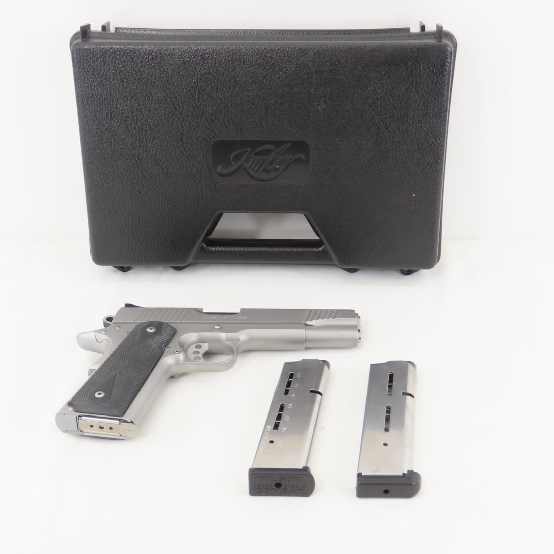Kimber 1911 Classic Stainless .45ACP Pistol: Kimber 1911 Classic Stainless .45ACP Pistol - SN# K045343, 5" barrel, front & rear 3 dot sight system, black checkered poly grips, textured backstrap, 1 KimPro 8 round magazine, 2 Wilson combat 8 roun