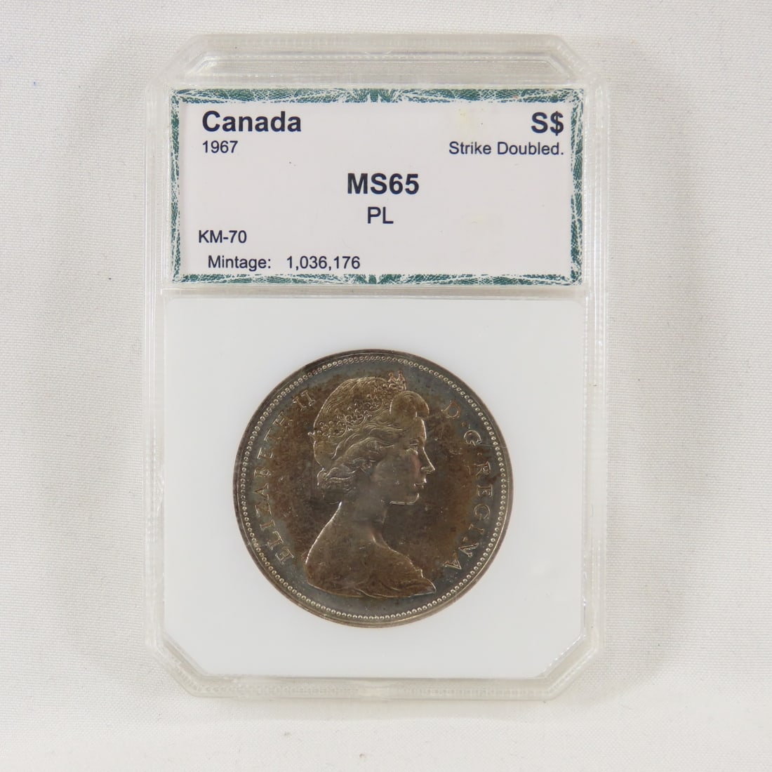 1967 Canadian Silver $1 PCI MS65 Strike Doubled: 1967 Canadian Silver $1 PCI MS65 Strike Doubled - Please ask questions & read terms and conditions before bidding.