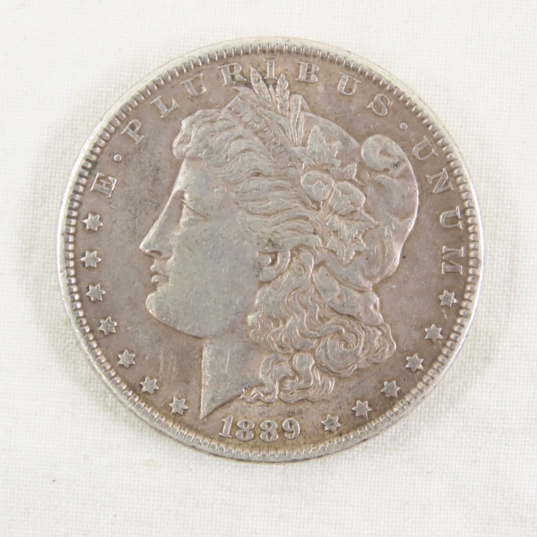 1889 Morgan Silver Dollar: 1889 Morgan Silver Dollar - Please ask questions & read terms and conditions before bidding.