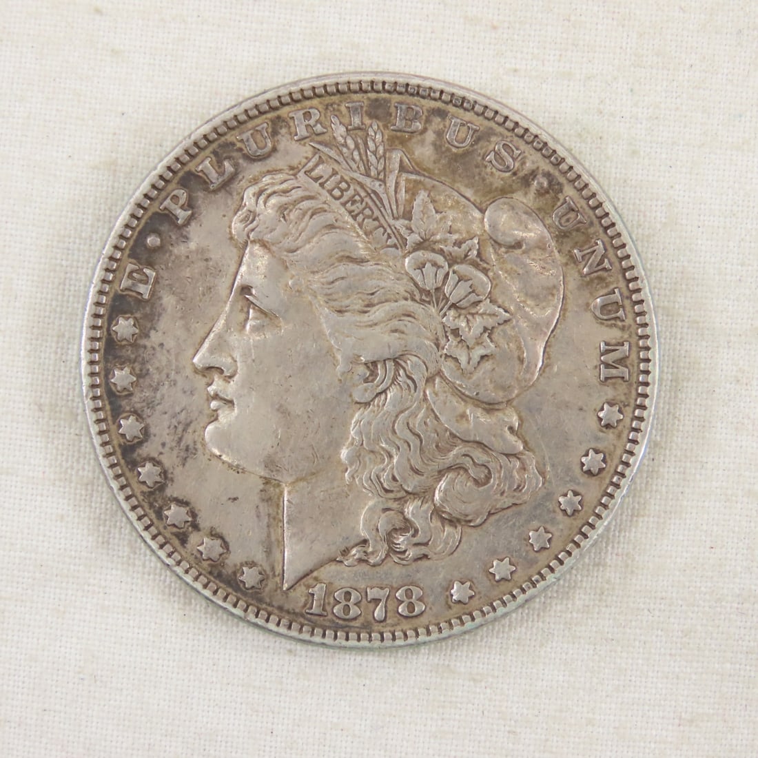 1878 Morgan Silver Dollar: 1878 Morgan Silver Dollar - Please ask questions & read terms and conditions before bidding.