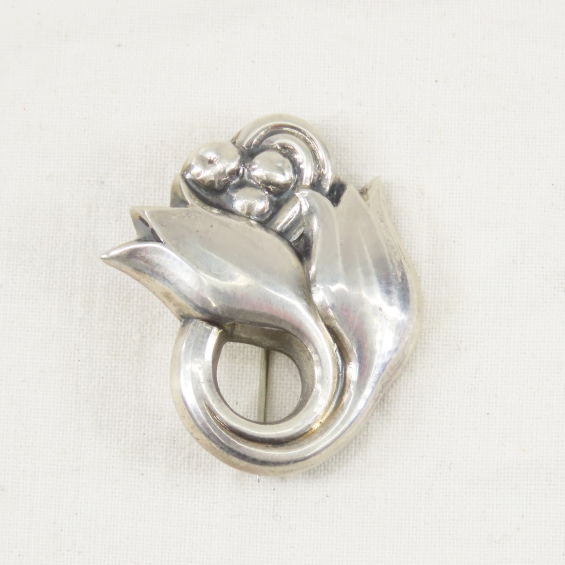 Georg Jensen Sterling Silver Tulip Brooch 100A: Georg Jensen Sterling Silver Tulip Brooch 100A - marked "Georg Jensen 925 S Denmark 100A" 6.8 grams Please ask questions and read terms & conditions before bidding.