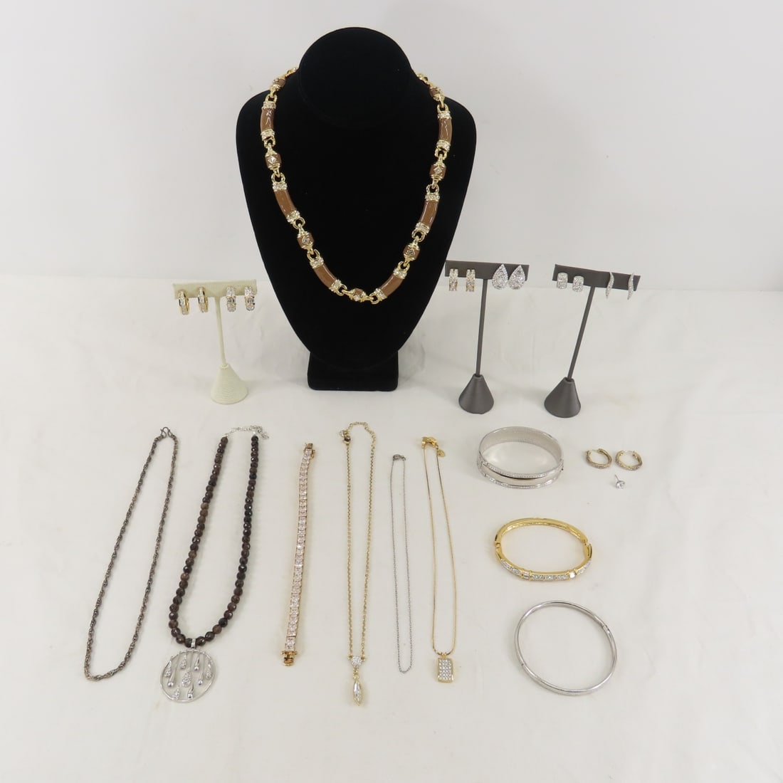 Swarovski, Givenchy, Sterling & Other Jewelry: Swarovski, Givenchy, Sterling & Other Jewelry - Sterling: vermeil tennis bracelet, bangle, 1 earring, 1 pair vermeil earrings, and 2 chains. Givenchy necklace, 1 Swarovski necklace & 4 pair earrings,