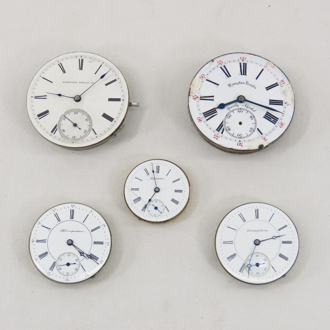 5 Hampden Pocket Watches- no cases: 5 Hampden Pocket Watches- no cases - 1 damaged dial missing second hand, 2 dials with cracks, all untested Please ask questions and read terms & conditions before bidding.