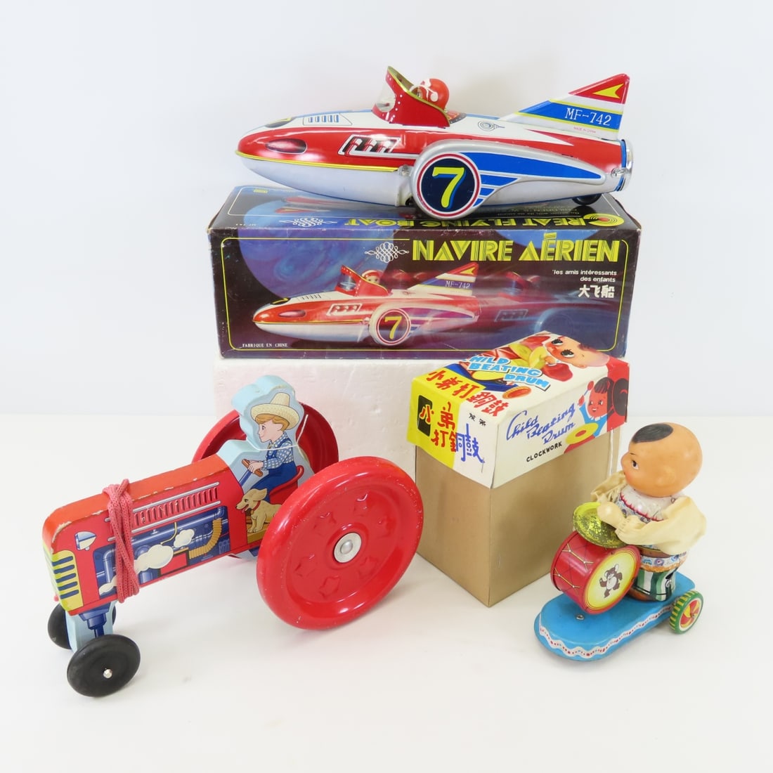 Tin Rocket Car, Child Banging Drum & Pull Tractor: Tin Rocket Car, Child Banging Drum & Pull Tractor - Please ask questions and read terms & conditions before bidding.