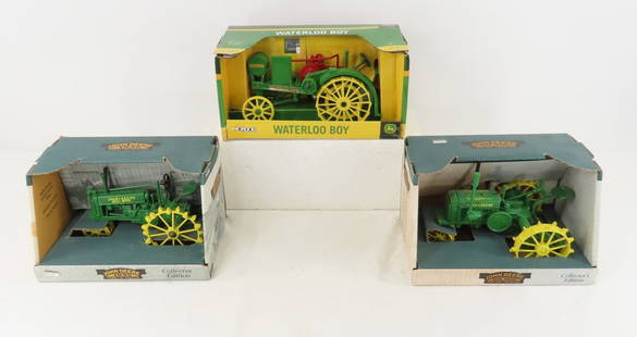 3 Ertl 1/16 Scale John Deere Tractors In Box: 3 Ertl 1/16 Scale John Deere Tractors In Box - 1931 GP Tractor 'Wide Tread', 1935 Model B Tractor, Waterloo Boy Please ask questions and read terms & conditions before bidding.