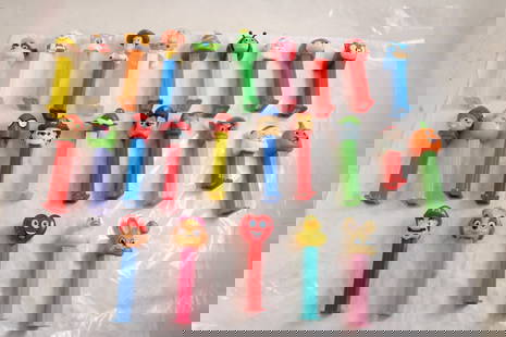 25 Collectible PEZ Containers: 25 Collectible PEZ Containers - As pictured. Please ask questions & read terms and conditions before bidding.