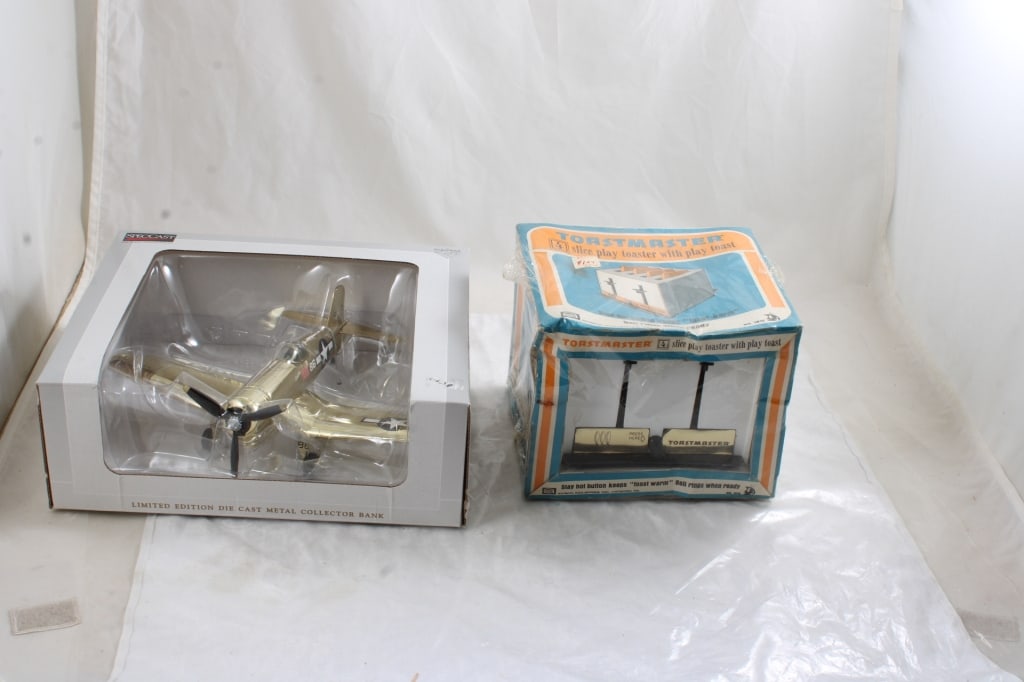 Amsco Toaster, Spec Diecast Airplane Corsair Bank: Amsco Toaster, Spec Diecast Airplane Corsair Bank - Both as pictured in Boxes. Please ask questions & read terms and conditions before bidding.