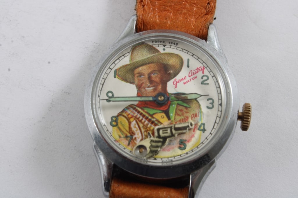 Gene Autry w/Six Shooter Mechanical Watch: Gene Autry w/Six Shooter Mechanical Watch - It will work with some coaxing, the pistol points up and down for the seconds. Swiss Made as pictured. Please ask questions & read terms and conditions befo