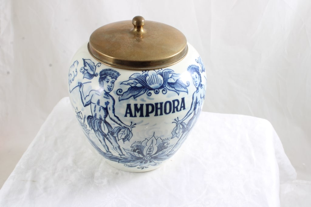 Delft Amphora Tobacco Jar Humidor: Delft Amphora Tobacco Jar Humidor - 7.5" Tall x 6" Wide with Brass Lid. As pictured. Please ask questions & read terms and conditions before bidding.