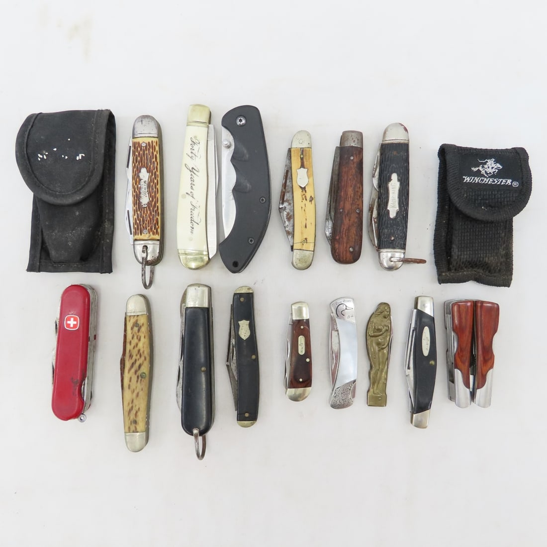 Vintage & Advertising Pocket Knives and Multi-tool: Vintage & Advertising Pocket Knives and Multi-tool - Small Winchester multi-tool in sheath, Buck 303, Stone River NRA, Kamp-King, Camillus, RMFF 478, Buck 380 NRA, Parker risque nude lady handle, and