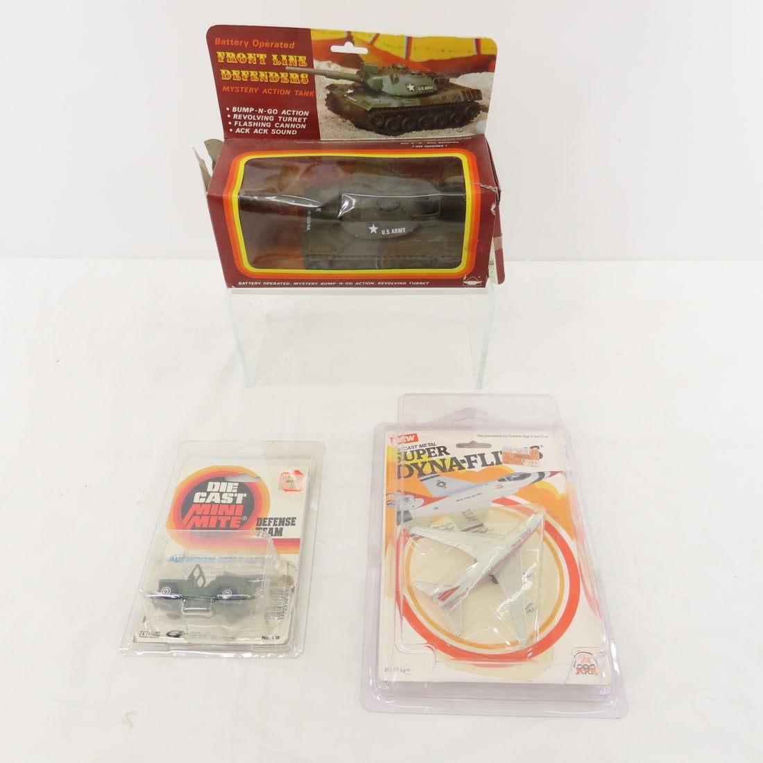 Battery Op Tank with box, Diecast toys on cards: Battery Op Tank with box, Diecast toys on cards - 1983 Super Dyna-Flites TWA plane in card, 1979 Gordy Diecast Mini Mite Defense Team on card, taped, Hong Kong Front Line Defenders Mystery Action Tank