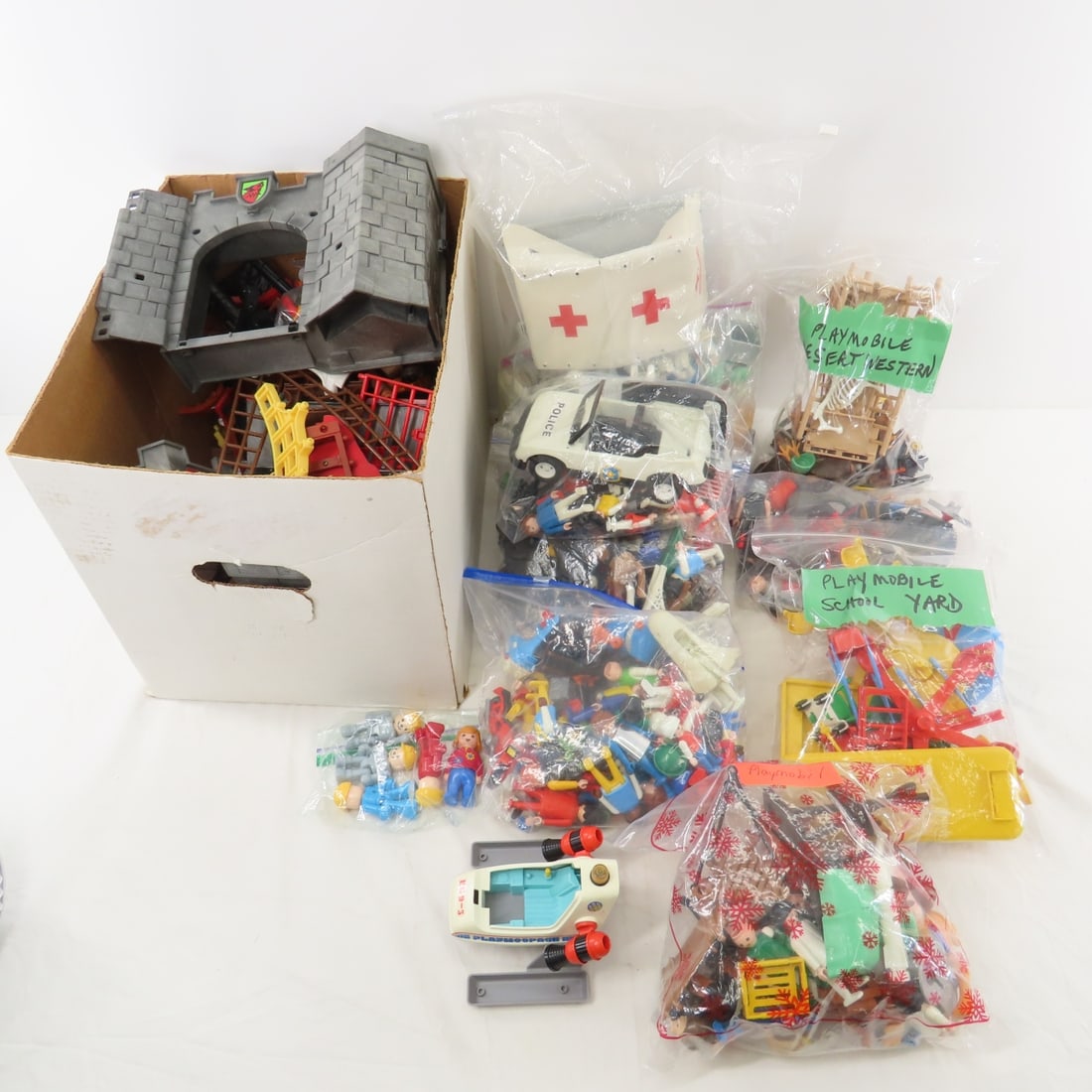 Vintage Playmobil Castle, Pirate, Hospital & More: Vintage Playmobil Castle, Pirate, Hospital & More - school yard, desert western pieces, some marked Geobra. Please ask questions & read terms & conditions before bidding. Live Auctioneers only display