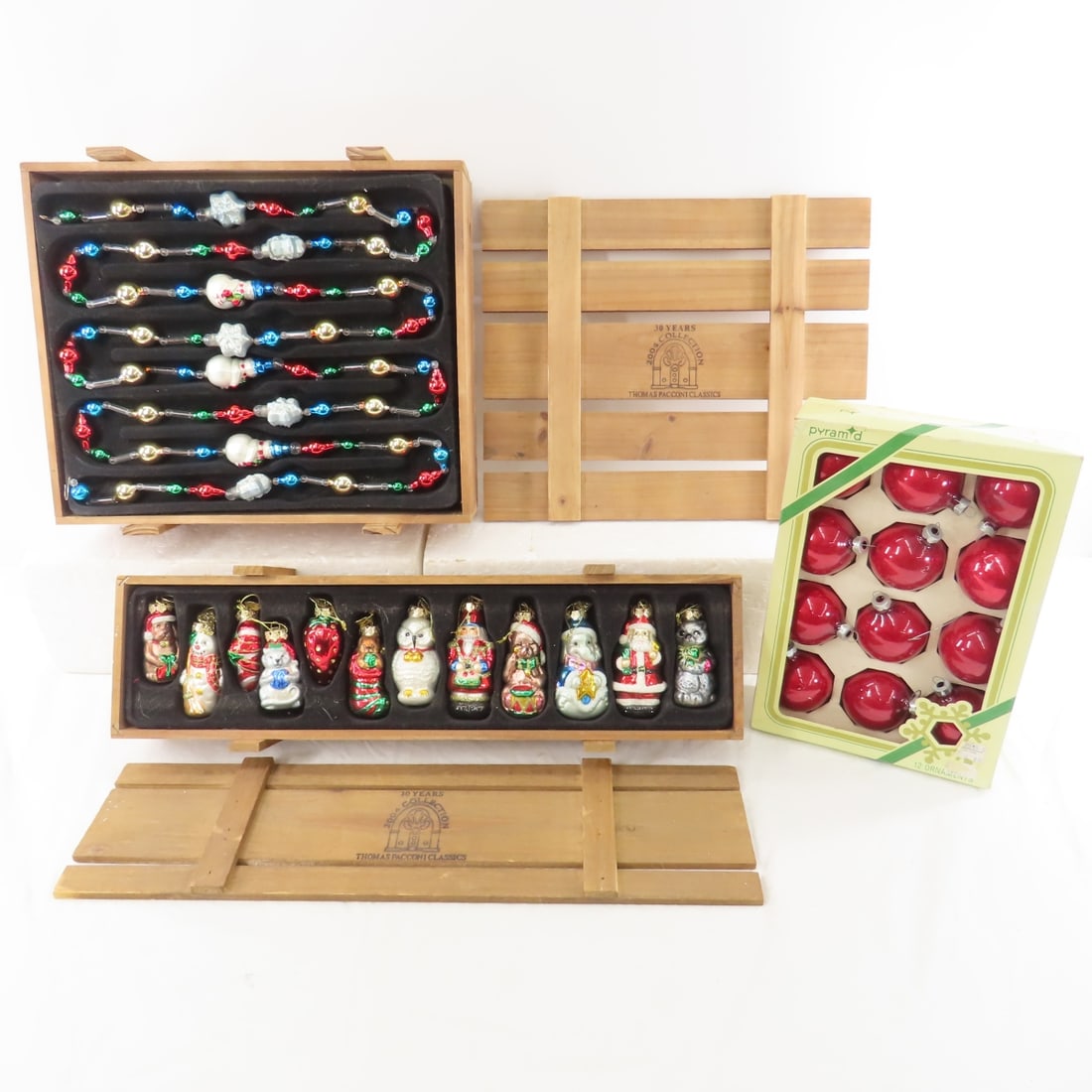 2004 Thomas Pacconi Christmas Garlands & Ornaments: 2004 Thomas Pacconi Christmas Garlands & Ornaments - 12 piece glass ornament set in crate, set of 2 glass garlands in crate, & set of 12 Pyramid ball ornaments Please ask questions & read terms & cond
