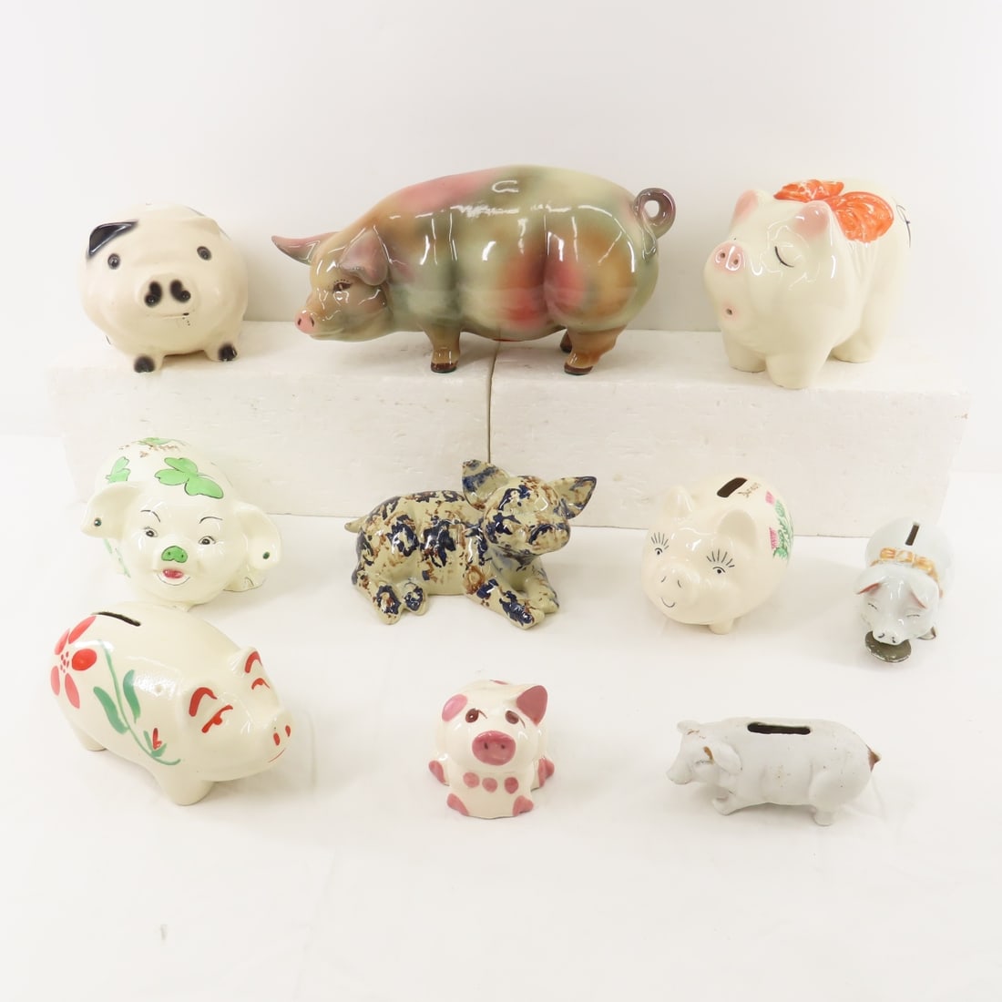 9 Vintage Ceramic Piggy Banks: 9 Vintage Ceramic Piggy Banks - 1 Dated 1958 & Signed Please ask questions & read terms & conditions before bidding. Live Auctioneers only display 20 photos per lot, whereas Proxibid and our A New Day