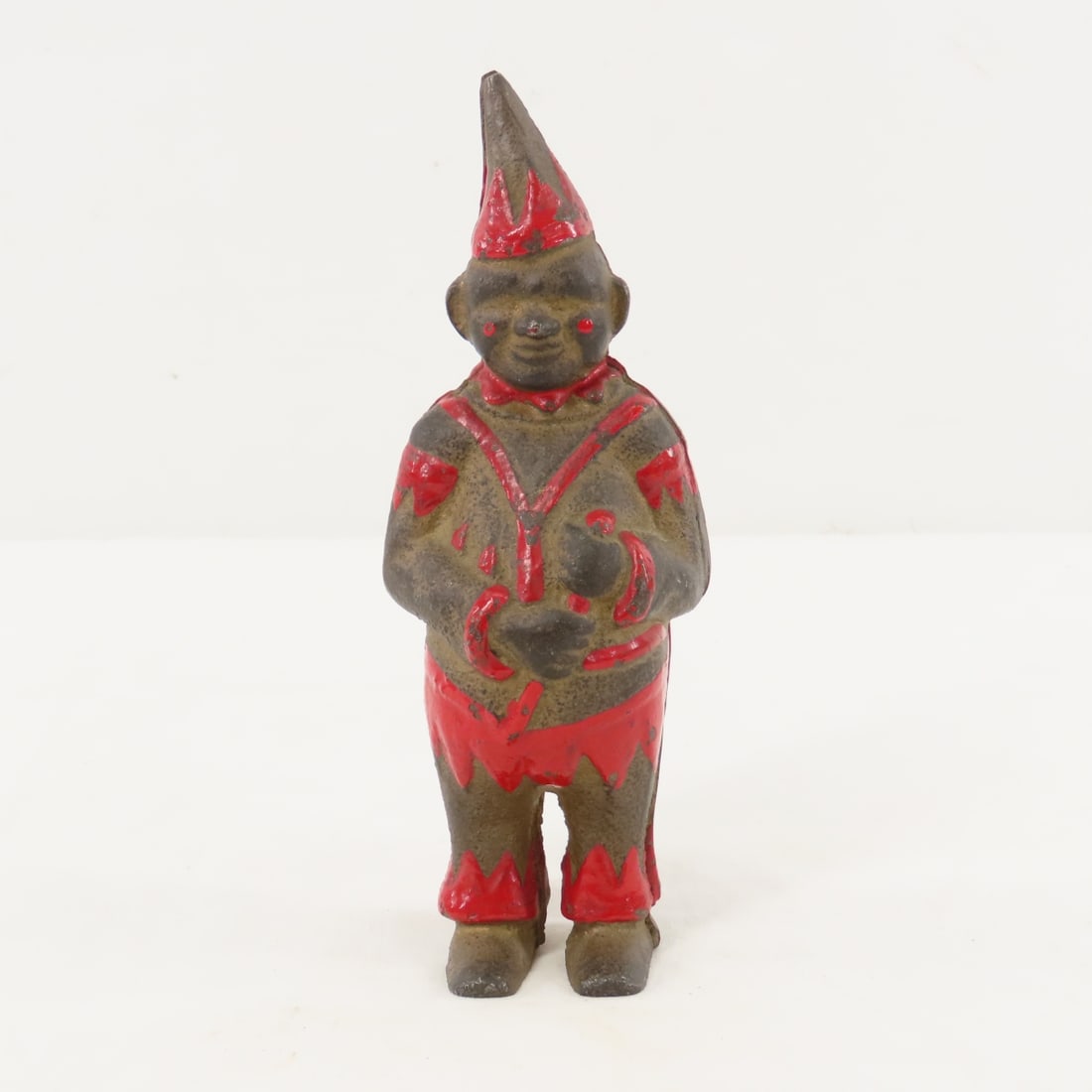 A.C. Williams Cast Iron Clown Bank: A.C. Williams Cast Iron Clown Bank - Please ask questions & read terms & conditions before bidding. Live Auctioneers only display 20 photos per lot, whereas Proxibid and our A New Day bidding app will