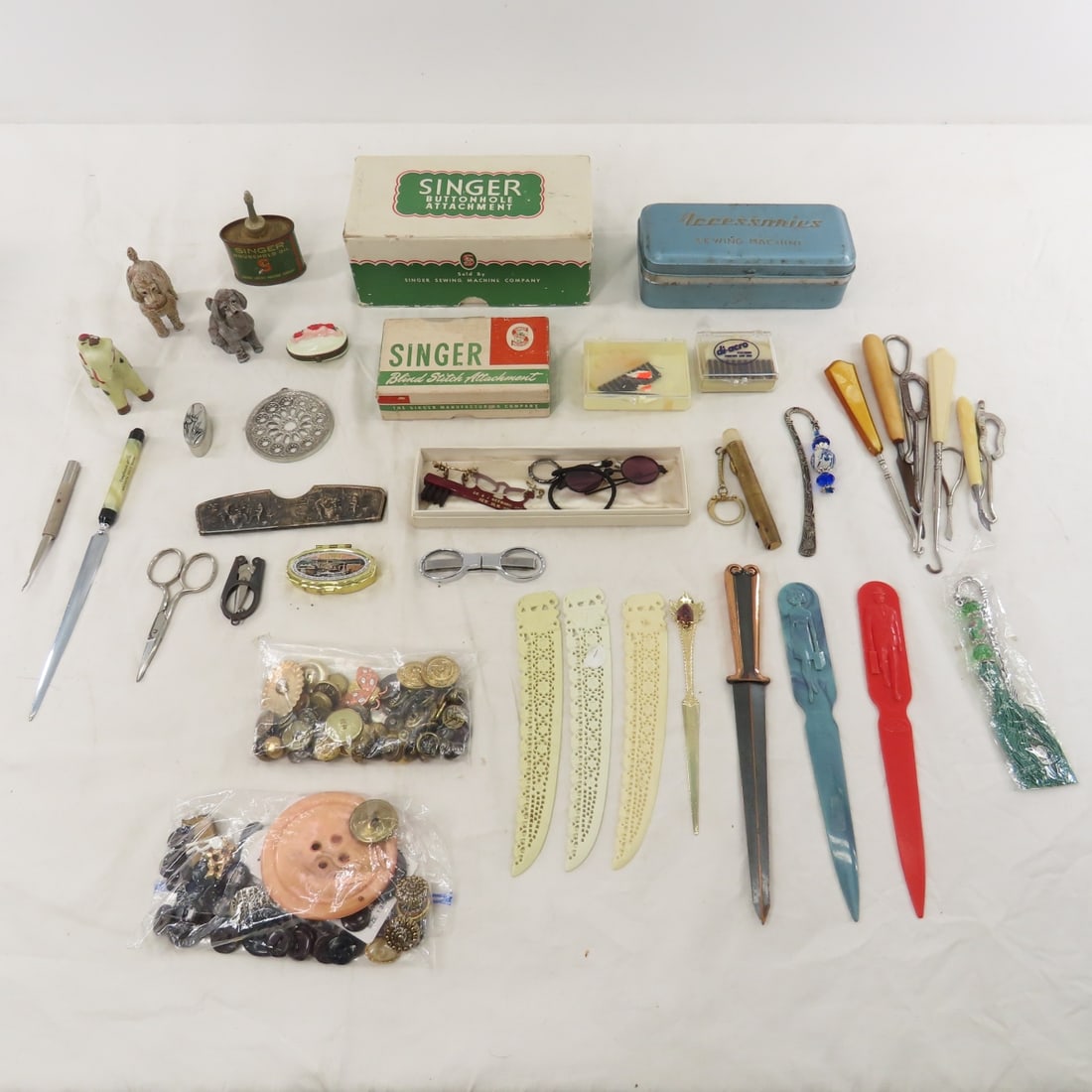 Dressing Hooks, Singer Buttonholer, Buttons & More: Dressing Hooks, Singer Buttonholer, Buttons & More - letter openers, ceramic giraffe- Japan, and more Please ask questions & read terms & conditions before bidding. Live Auctioneers only display 20 ph