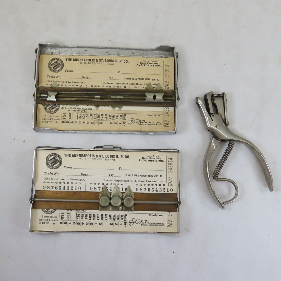 2 M&STL Cash Fare Receipt Holders & Ticket Punch: 2 M&STL Cash Fare Receipt Holders & Ticket Punch - 1 holder has Joslin's patent on back , McGill Bros "L" ticket punch Live Auctioneers only shows 20 photos- all photos are viewableon Proxibid. https: