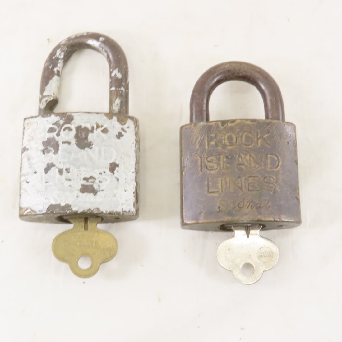 2 Rock Island Lines Signal Padlocks with keys: 2 Rock Island Lines Signal Padlocks with keys - Live Auctioneers only shows 20 photos- all photos are viewableon Proxibid. https://www.proxibid.com/A-New-Day-Auctions-LLC/10-4-6th-Annual-Railroadiana-