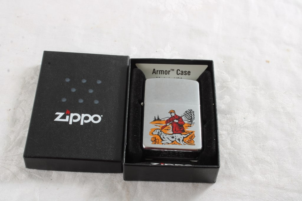 1981 Hunter Pheasant Rifle Dog Zippo Lighter w Box: 1981 Hunter Pheasant Rifle Dog Zippo Lighter w Box - As pictured. Please read terms and conditions and askquestions before bidding. Live Auctioneers only shows 20 photos per lot. All photos can be vie